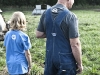 Paul and granddaughter Sophia Willis surveying their hogs